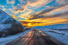 Colorful Sunrise On A Mountain Road In Winter