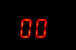 Old digital clock red number on black background