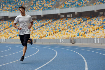 Sticker - Sportsman running on treadmill on sports stadium