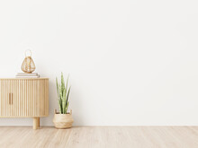 Wall Mockup In Living Room Interior With Wooden Slat Curved Furniture, Trendy Green Snake Plant In Basket And Wicker Lantern On Empty White Background. 3D Rendering, Illustration