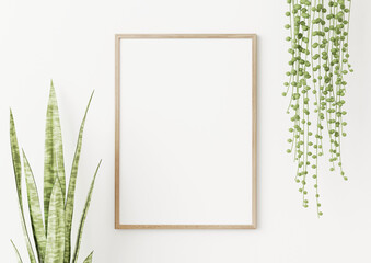 Wall Mural - Wooden frame mockup in simple interior with trendy green snake plant and string of pearls on white background. 3D rendering, illustration