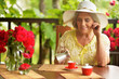 © aletia2011 - Portrait of cute happy aged woman drinking coffee