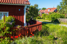 Street View In Sandham, Sweden. Village House, Garden And Footpath