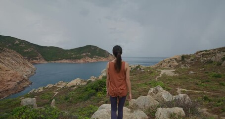 Sticker - Woman enjoy hiking in Po Toi island in Hong Kong