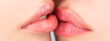 © Yevhen - Closeup of beautiful young woman healthy lips. Lesbian couple kiss lips. Passion and sensual touch. Closeup of women mouths kissing. Two beautiful sexy lesbians in love. Lip care and beauty