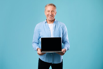 Poster - Happy mature man showing black empty laptop screen