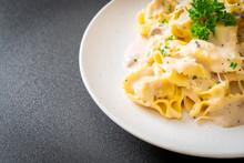 Tortellini Pasta With Mushroom Cream Sauce And Cheese