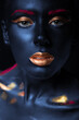 fashion portrait of a blue-skinned girl with color make-up. Beauty face.