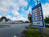 Fototapeta Konie - Danish Border street sign in Krusa Danmark saying Danmark (Denmark) on the Danish and German border road