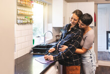 Lesbian Couple Expecting A Baby And Cooking