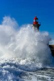 Fototapeta Miasto - red lighthouse in the sea