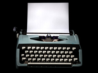 Vintage typewriter, writer or author's tool, inspiration and creativity. On a black background.