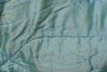 Background Of A Fabric From A Piece Of Crumpled Blue Gray Dirty Cloth