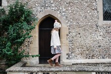 Girl Walking On An Old English Stone Wall In Winchester