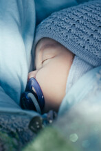 Close-up Portrait Of Sleeping Baby With Pacifier