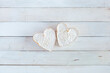 Two heart shape cheese on the white wooden background, concept of Valentine Day