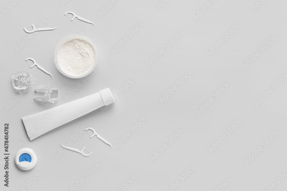 Set of dental hygiene on grey background