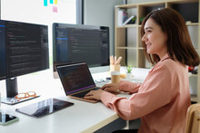 Asian Female Programmer Working At At Modern Office. Developing Programming.