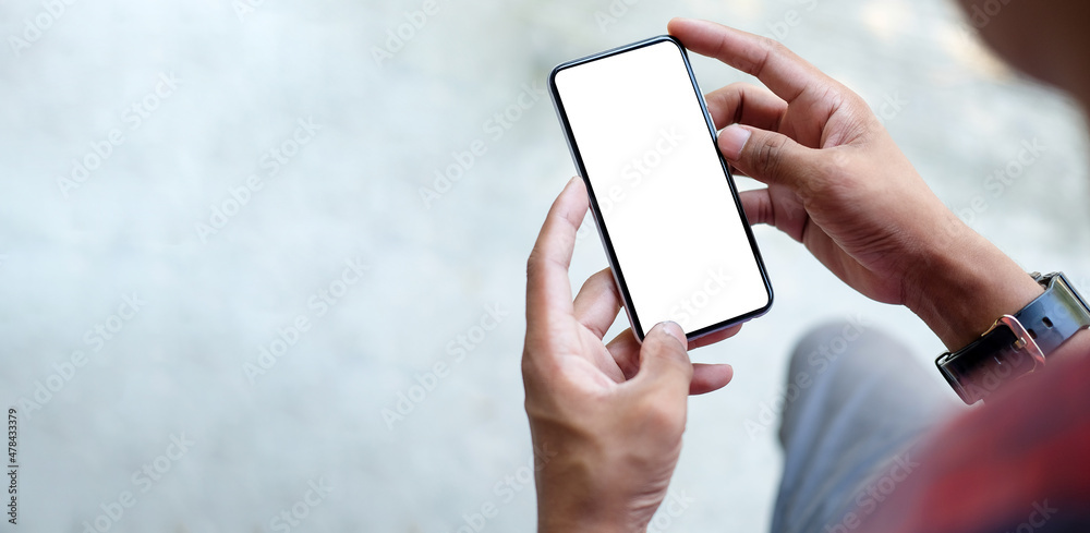 Close up view of businessman holding mock up smart phone with blank ...