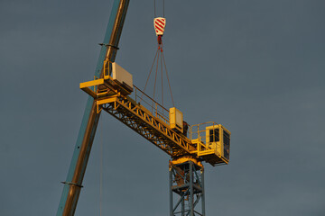 Canvas Print - Construction site. Building up a new crane. Construction industry.