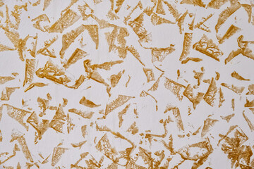 Wall Mural - grainy beige background and wallpaper with golden and white spots. texture backdrop with small crumb
