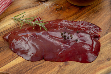 Wall Mural -  slice of raw liver on a cutting board