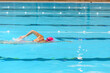 Swimmer swimming borstcrawl alone in an empty swimming pool