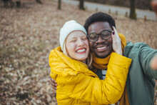 Hiking Couple - Active Young Couple In Love. Couple Taking Self-portrait Picture On Hike. Happy Romantic Interracial Couple. Cute Young Couple Of Millennial Or Generation Z Adventurers Or Travellers