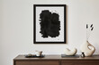 © FollowTheFlow - Minimalistic composition of creative living room interior with mock up poster frame and stylish small personal accessories on wooden commode. Copy space. Template. Real photo..