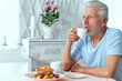 © aletia2011 - Portrait of senior man drinking tea at home