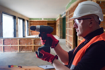 Poster - Builder screwdriver. Man repairman at construction site. Worker in safety helmet. Repairman grandfather screwdriver in front of him. Concert of career builder. Work as foreman at construction site