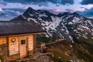 Poster - IluminatedLuxury Wooden Chalet at High Peak Mountain Top at Sunset in Austria Alps