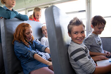School Kids Riding School Bus