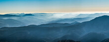  White Snow And Blue Sky. Panoramic View Of The Silhouettes Of The Mountains.