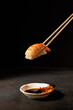 shrimp sushi with chopsticks