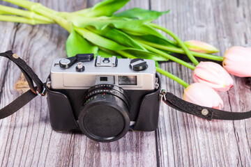 Retro camera on a wooden table