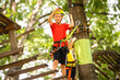 © Angelov - Boy climber walks on the rope bridge,