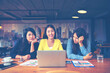 © tonjung - Happy businesswoman using laptop in the office.woman working on a laptop in cafe.