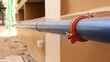 Grooved Coupling on plumbing pipes. Syler plumbing pipe connected with coupling on the side of the building with copy space. Selective focus