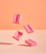 Few pink chewing gums in the air. Sweet fruity youth composition. Positive summer mood.