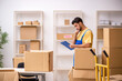© Elnur - Young male contractor doing home relocation