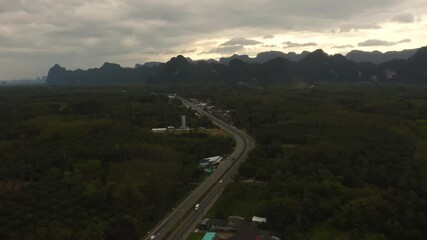 Wall Mural - 4k aerial drone footage flying over mangroves and lush rainforest in phangnga bay thailand the view 