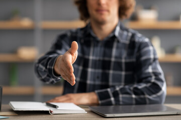 Poster - Businessman Stretching Hand For Handshake Greeting Sitting At Workplace, Cropped