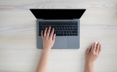 Aufkleber - Technology concept. Woman using personal laptop with empty monitor, typing on keyboard and holding computer mouse