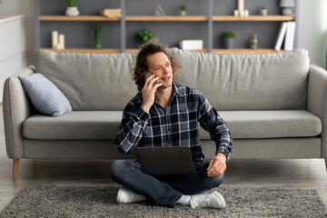 Poster - Freelancer Guy Speaking By Cellphone Sitting With Laptop At Home