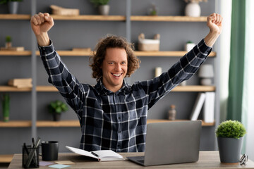 Poster - Businessman Shaking Fists In Joy Looking At Laptop In Office