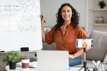 Poster - Female teacher in headphones explaining trigonometric functions to students online