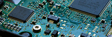 Macro Close Up Of Components And Microchips On PC Circuit Board