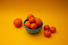 Citrus Oranges In A Bowl On A Yellow Background