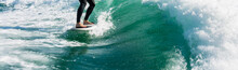 Wakeboarding. Close Up Of Woman In Wetsuit Learning To Wakesurfing Behind Wakeboard Boat. Female Surfing Motorboat Waves On River. Banner Image With Copy Space